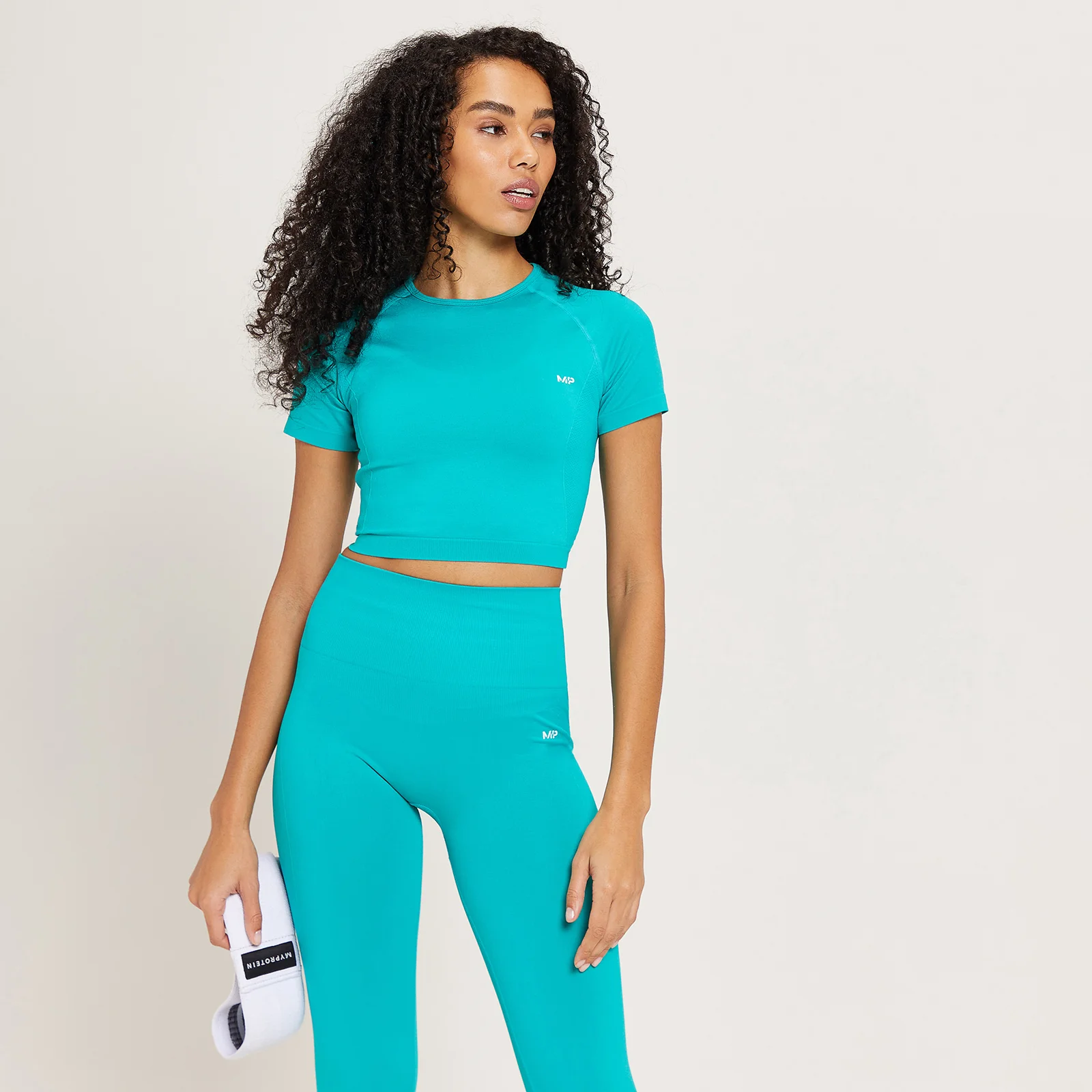 MP ženski Shape crop top bez šavova - boja lagune - XXS Slika 1